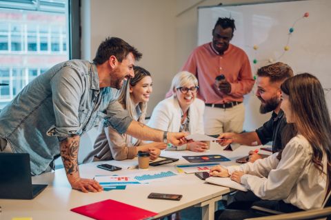 Image of People in a meeting around a desk