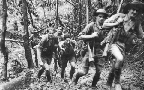World War 2 Australian Solders on the muddy Kokoda Track