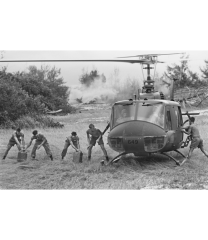 A RAAF Iroquois helicopter, A2-649, from No 9 Squadron re-supplies troops of the First Australian