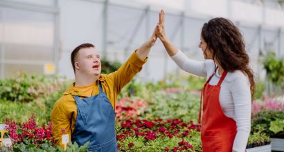 image of a woman florist helping young employee