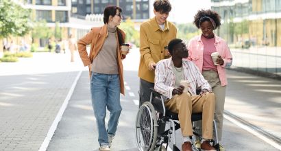 People walking with friend with disability, Photos - Envato Elements